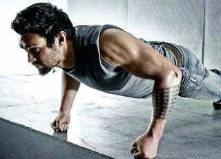A man doing knuckle push ups
