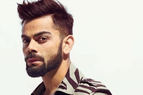 Virat kohli in a funky brush cut hairstyle.