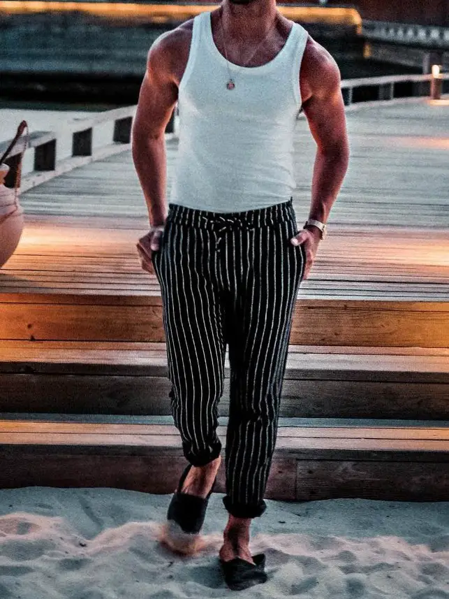 A striped/linen trouser with a wife beater