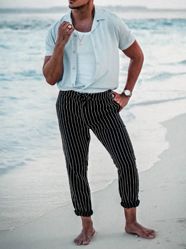 a innerwear banyan, a half sleeve's t-shirt paired up with striped trousers.