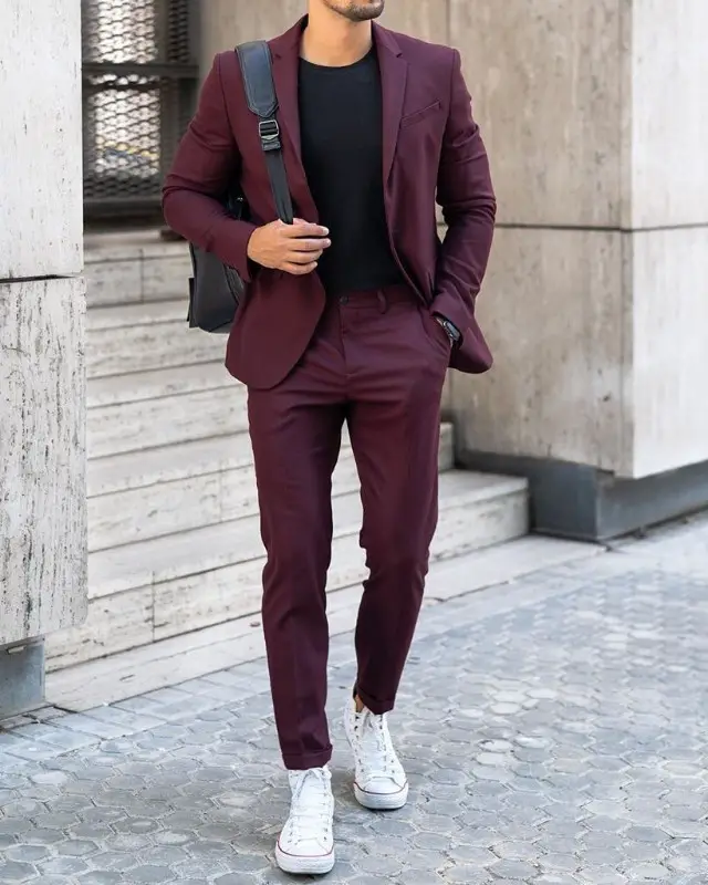 Men in wine color suit and black t-shirt.