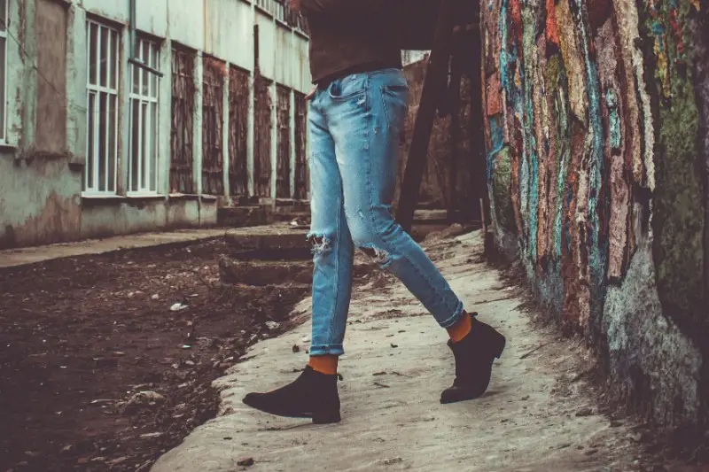 A man wearing Chelsea boots.