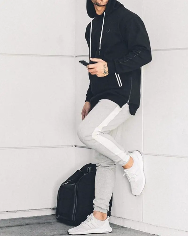 Man wearing Hoodie and joggers.