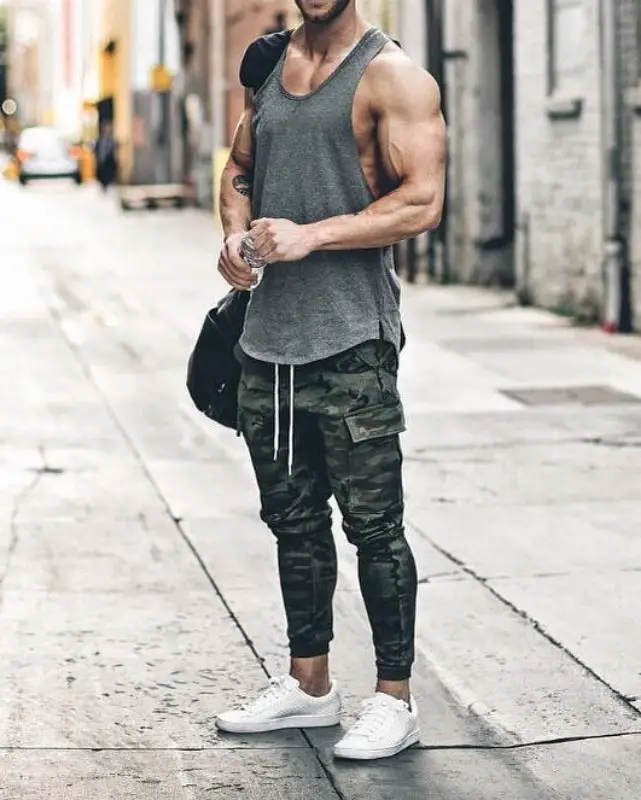 Man wearing Wife beater and joggers.