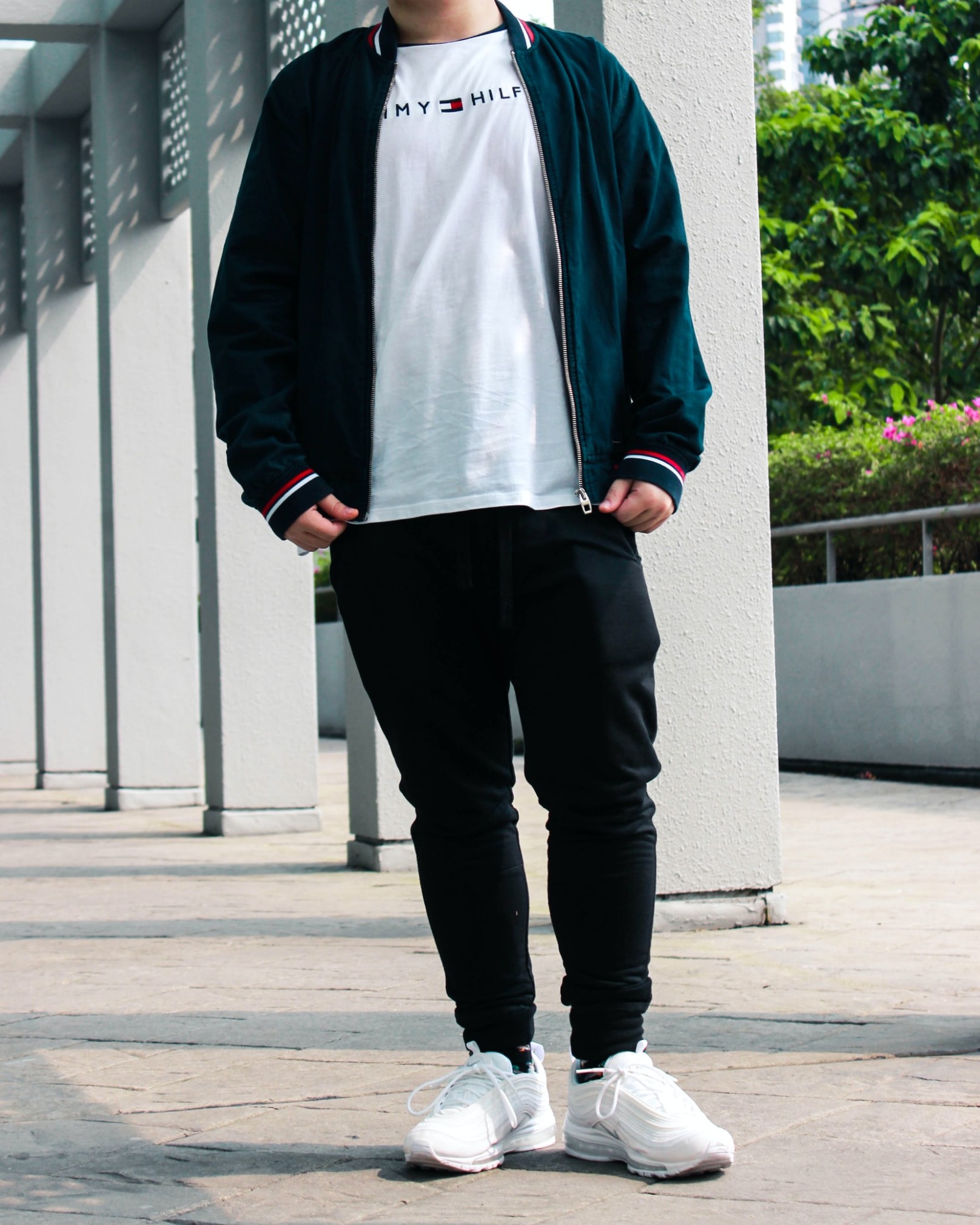 Man wearing, Bomber jacket over crew neck t-shirt and joggers.