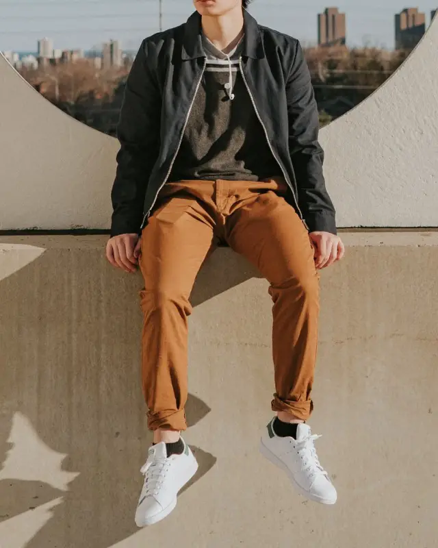 Man wearing Track jackets over crew neck tee and stretchable pant.