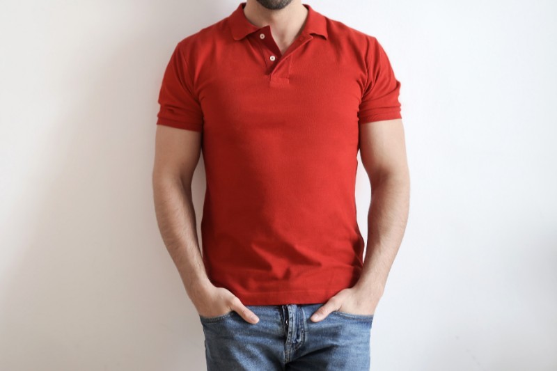 A man wearing red colour polo t-shirt.