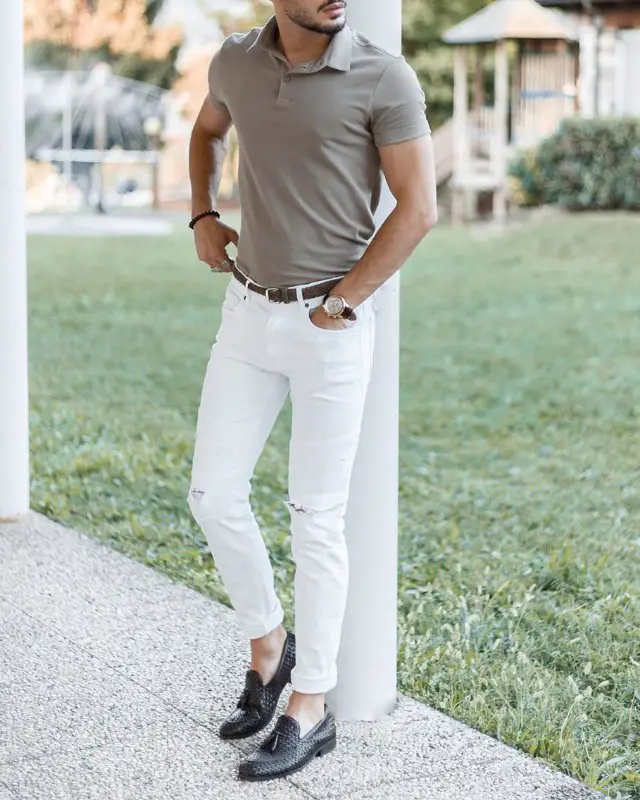 A man wearing grey colour polo t-shirt and white jeans