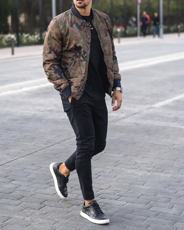 Man in Bomber jackets, crew neck sweatshirt and jeans.