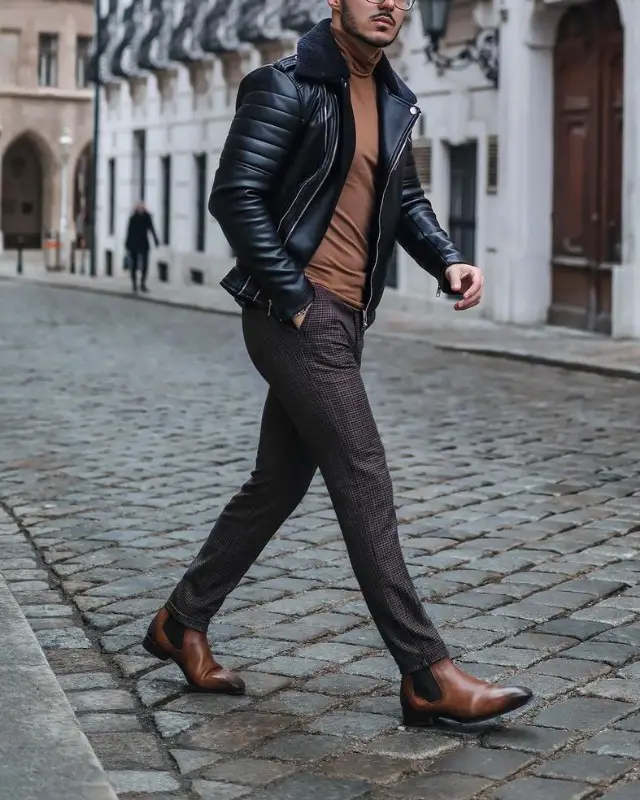 Leather jacket + high neck sweatshirt + Chelsea boots + trousers.