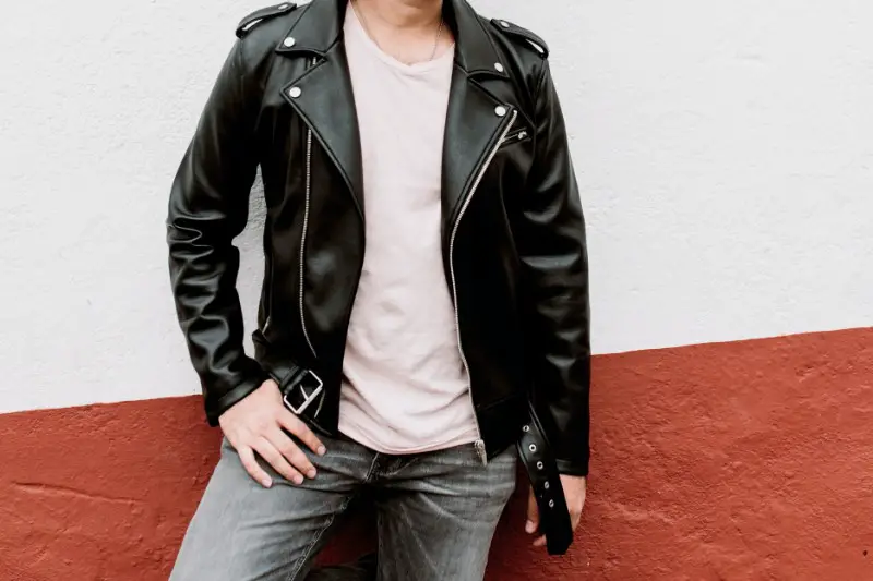 A man in black leather jacket.