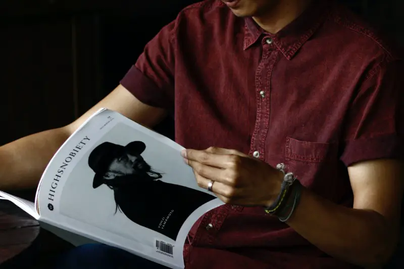 A man reading a magazine.