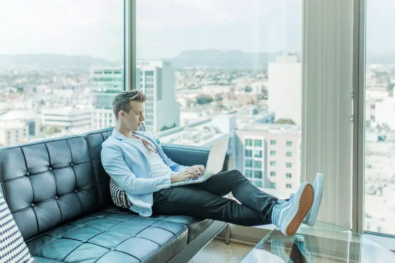 A man operating his laptop.