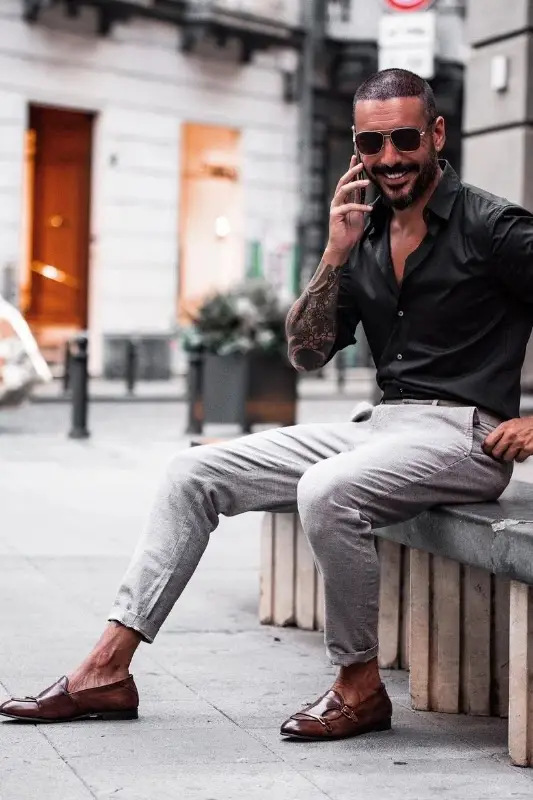 Grey pant black shirt with brown shoes
