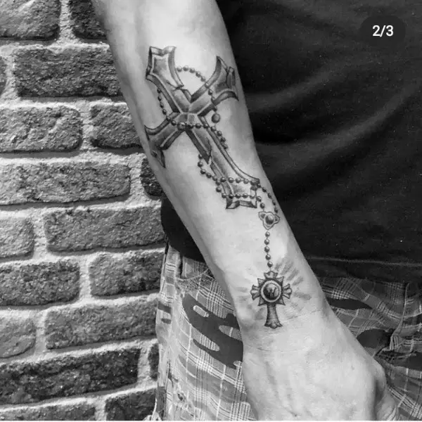 Upper forearms cross tattoos