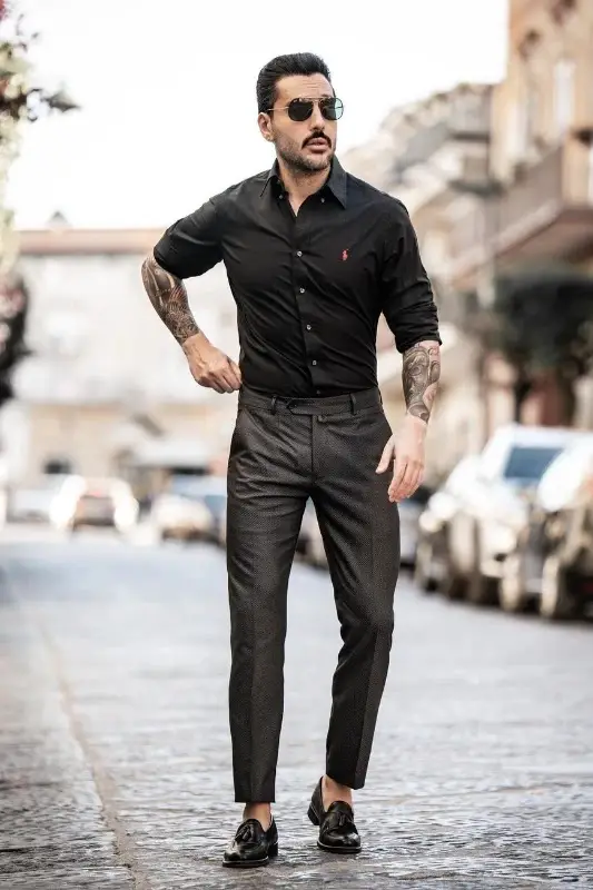 Black shirt with faded black trousers