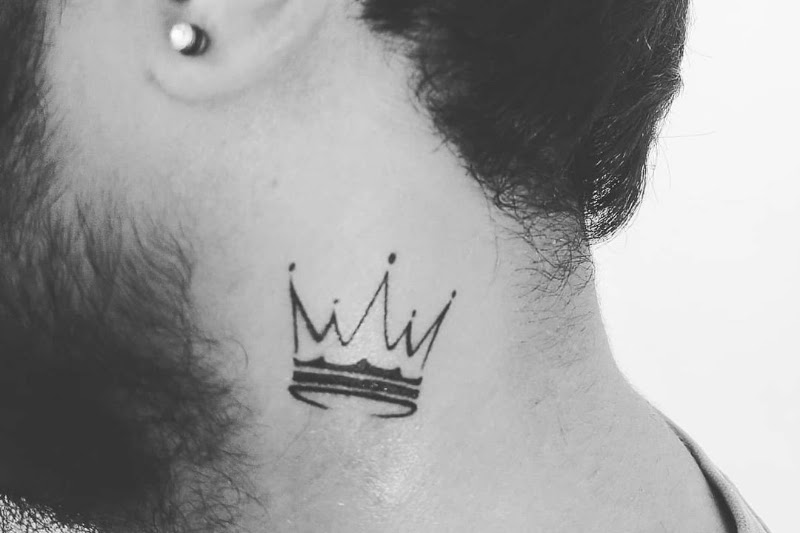 Small neck tattoo design, crown.