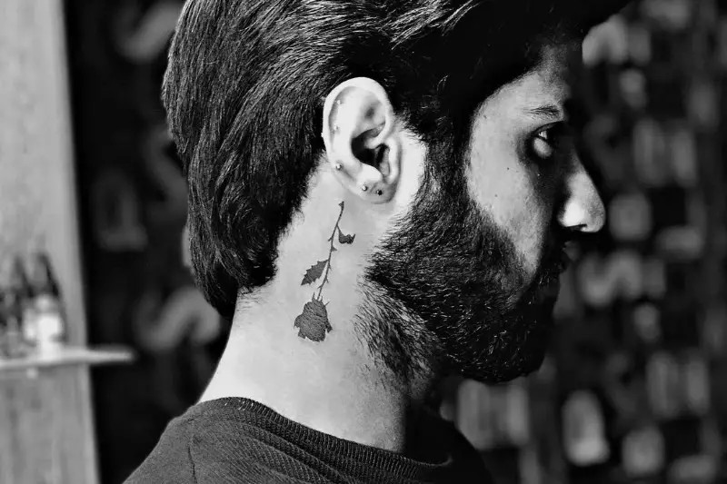Flower or rose men's neck tattoos designs