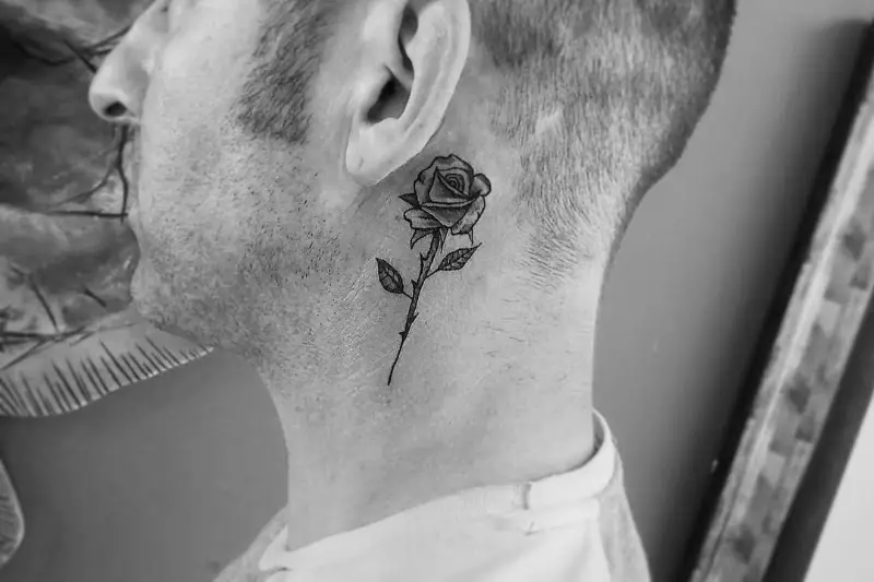 Flower or rose men's neck tattoos designs