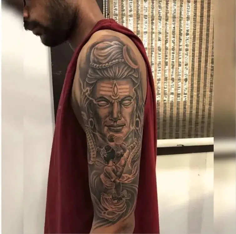 Shiva tattoo on shoulder