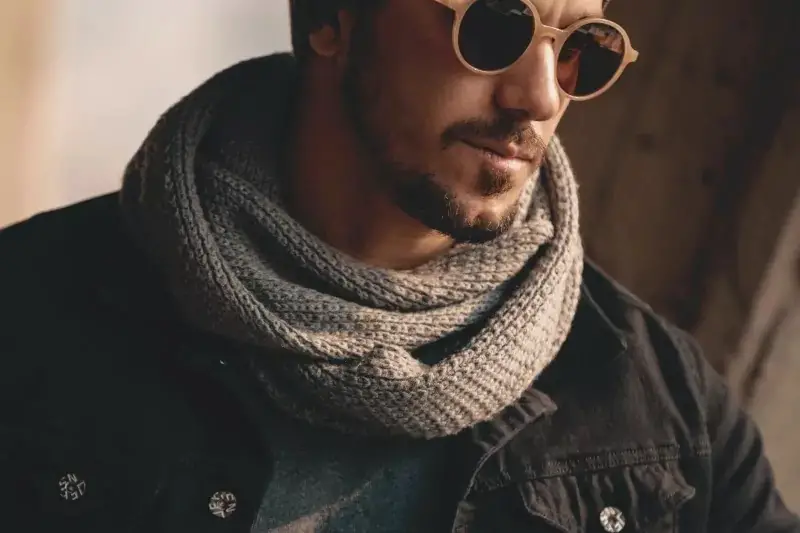 A guy wearing a brown scarf.