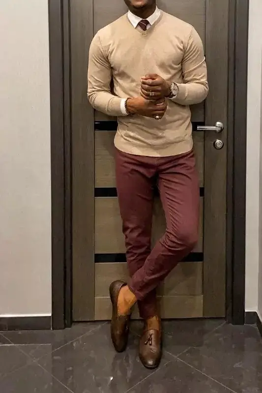 Beige sweater and maroon trousers, men's outfit.