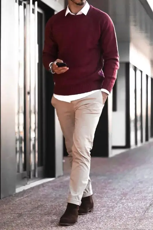 Maroon sweater and beige pants, men's outfit.