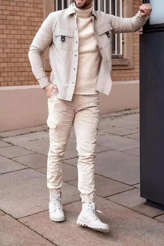 Beige jacket, high - neck and jeans, men's outfit.