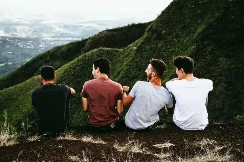 Four guys talking and chilling.