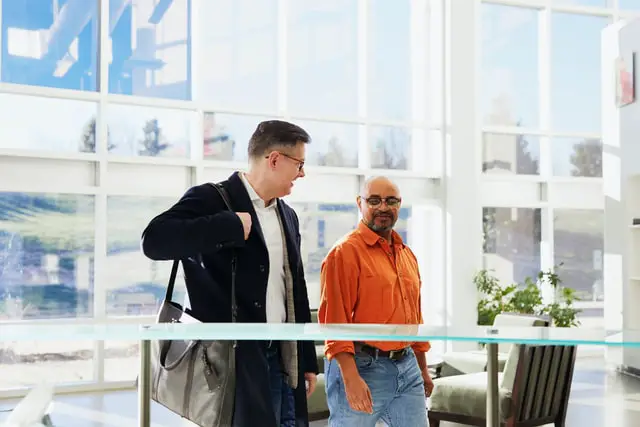 Two men talking with a proper manner